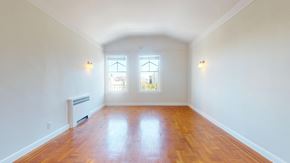 San Francisco apartment for rent - A room with wooden floors and two windows.