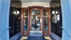 San Francisco apartment for rent - A set of double doors with a glass panel and metal grill work.