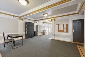 San Francisco apartment for rent - Lobby with a parcel and mail locker, anAmazon Hub Locker and front desk table