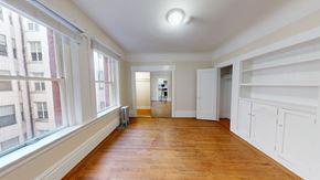 San Francisco apartment for rent - A room with wooden floors and white walls.