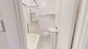 San Francisco apartment for rent - A white bathroom with a toilet, sink and bathtub.