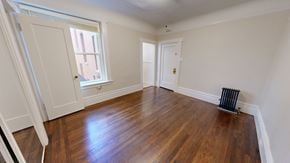 San Francisco apartment for rent - A room with wooden floors and white walls.