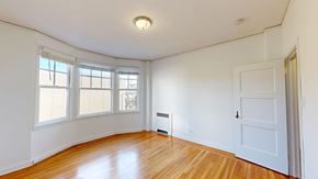 San Francisco apartment for rent - A room with a white door and a window with blinds.