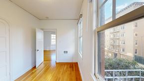 San Francisco apartment for rent - A room with wooden floors and white walls.