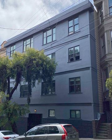 San Francisco apartment for rent - a white building with cars parked in front of it
