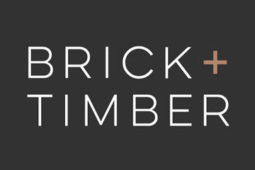 San Francisco apartment for rent - A black background with the words "Brick + Timber" in white and a brown plus sign in the middle.