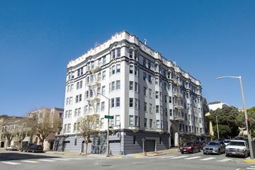 San Francisco apartment for rent - a large white building on the corner of a city street