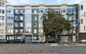 San Francisco apartment for rent - A tree in front of a building with cars parked in front of it.