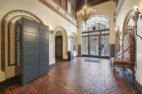 San Francisco apartment for rent - Elegant building entrance with ornate decor, Amazon Hub locker, tiled floor, wrought iron fixtures