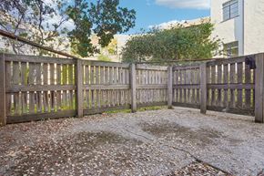 Berkeley apartment for rent - Wooden fence with a yard in front of a house