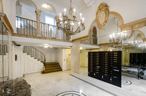 San Francisco apartment for rent - Elegant lobby with a grand staircase, a chandelier, and Victorian-style interior design