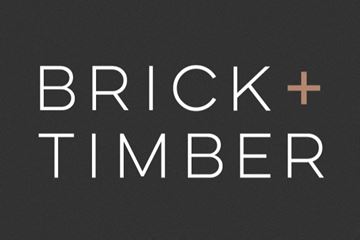 San Francisco apartment for rent - A graphic with the words "Brick + Timber" in white and tan on a black background.