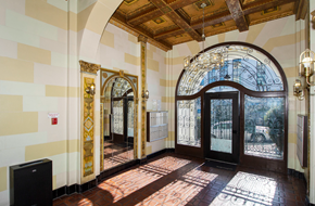 San Francisco apartment for rent - Lobby entrance to a building featuring a large arched door and a large mirror