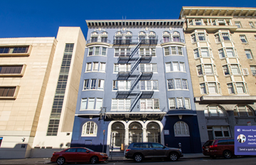 San Francisco apartment for rent - A blue building with a fire escape on the side.