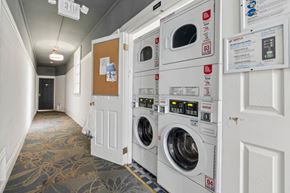 San Francisco apartment for rent - Laundry room with washing machines neatly arranged on a wooden floor