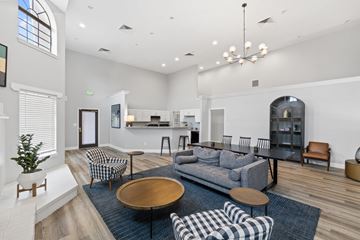Indianapolis apartment for rent - A living room with a grey couch and a wooden coffee table.