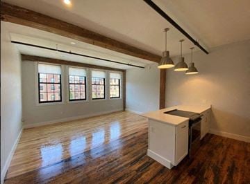 Biddeford apartment for rent - A kitchen area with a white counter and a stove is shown.