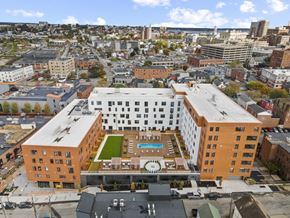 Portland apartment for rent - an aerial view of a building with a clock on the side of it
