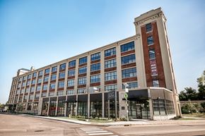 Biddeford apartment for rent - A large, modern building with a mix of brick and glass windows.