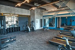 Biddeford apartment for rent - A gym with treadmills, weights, and exercise equipment.