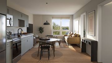 Biddeford apartment for rent - A modern kitchen with a dining table and chairs in the middle of the room.
