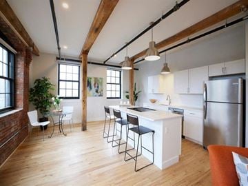 Biddeford apartment for rent - A kitchen with a white counter and a refrigerator.