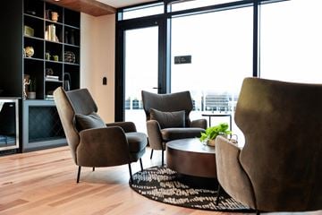 Portland apartment for rent - A living room with a table and chairs.
