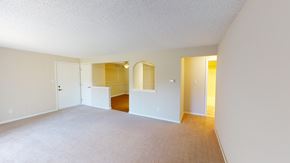 Orchard Park apartment for rent - an empty living room and dining room with white walls