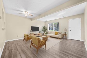 Kent apartment for rent - A living room with a white couch and a television.