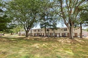 Kent apartment for rent - A grassy area with trees and apartment buildings in the background.