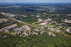 Kent apartment for rent - an aerial view of a city with a highway and trees