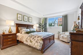 Easton apartment for rent - A bedroom with a large bed and a chair.