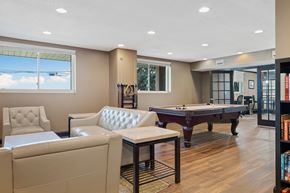 Easton apartment for rent - A room with a pool table and a chair.