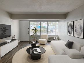 St. Peterburg apartment for rent - a living room with white furniture and a large window