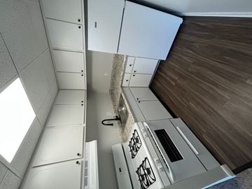 Easton apartment for rent - an overhead view of a kitchen with white cabinets and a counter
