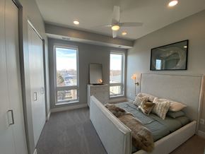 Minneapolis apartment for rent - a bedroom with a bed and a ceiling fan