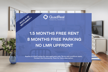 Mississauga apartment for rent - A blue advertisement board for QuadReal REALTORS advertising free rent and parking.
