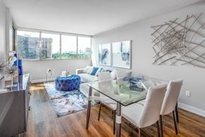 Mississauga apartment for rent - Open concept living and dining room staged with furniture.