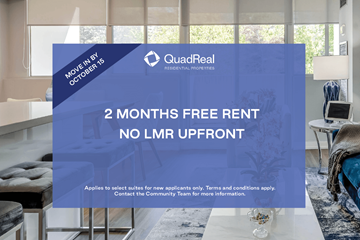 Mississauga apartment for rent - A room with a sofa and a table with a lamp, advertising a 2 months free rent offer.