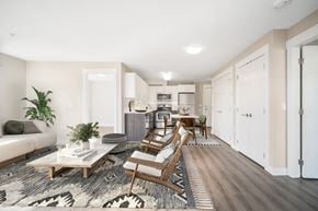 North Vancouver apartment for rent - Beautifully staged two-bedroom apartment, looking from the living room straight through to the kitchen.