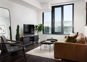 Mississauga apartment for rent - a living room with a couch and a chair and a television