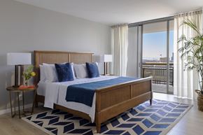 Oakland apartment for rent - a bedroom with a bed and a view of the city