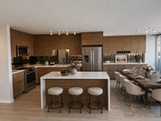 Oakland apartment for rent - A modern kitchen with a central island and bar stools.