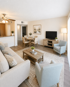 Loma Linda apartment for rent - A living room with a grey couch, a coffee table, a television, and a lamp.