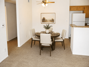 Oceanside apartment for rent - A dining room with a table set for four.