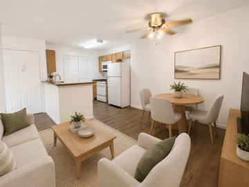 Oceanside apartment for rent - A living room with a dining table and chairs.