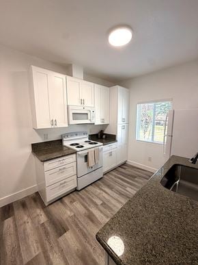 Johnson City apartment for rent - A kitchen with white cabinets and a granite counter.