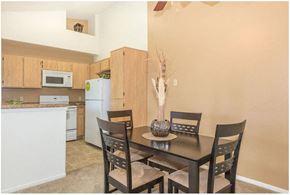 Oceanside apartment for rent - a kitchen and a dining room with a table and chairs at Riverview Springs, California