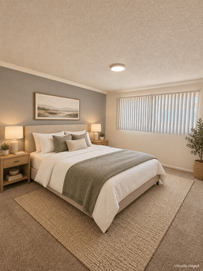 Bellflower apartment for rent - A bedroom with a large bed and a painting on the wall.
