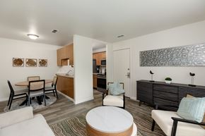 Clio apartment for rent - A living room with a white couch and a wooden coffee table.